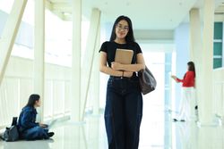 Portrait Confident Young Asian Female College Student Standing on Campus Hallway