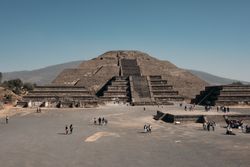 Tourists exploring ancient pyramids in Teotihuacan Valley