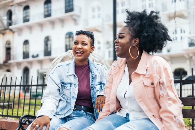Black women talking and laughing in the city