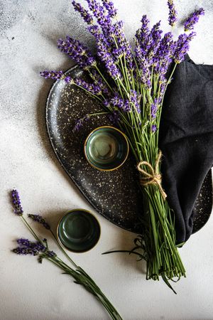 Dark plate with a bunch of lavender flowers