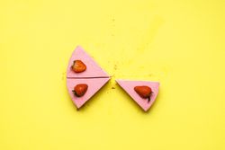 Three slices of strawberry cheesecake