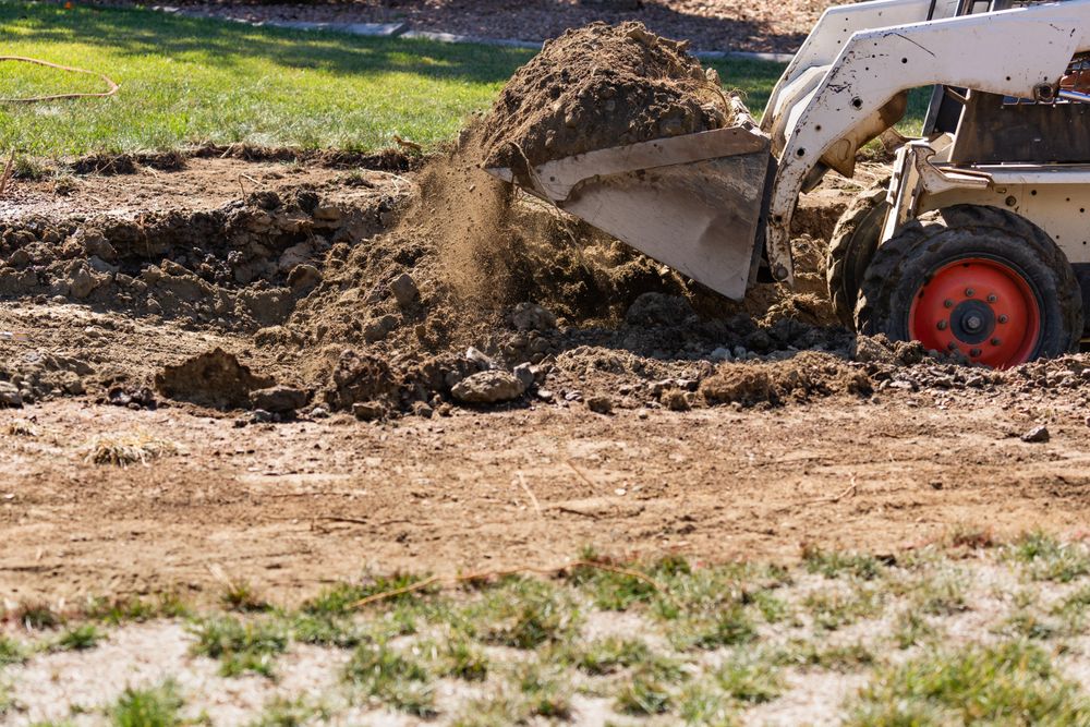 Small Bulldozer Digging In Yard For Pool Installation