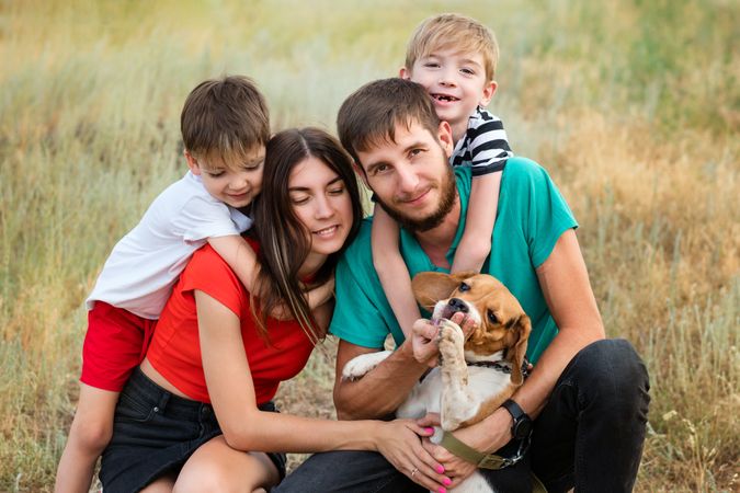 Family walk and training dog