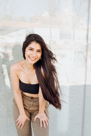 female model standing near wall