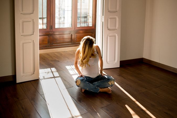 Pregnant woman relaxing on floor