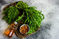 Fresh dill and arugula with chili flakes and oil