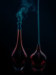 Glass bottles emitting smoke