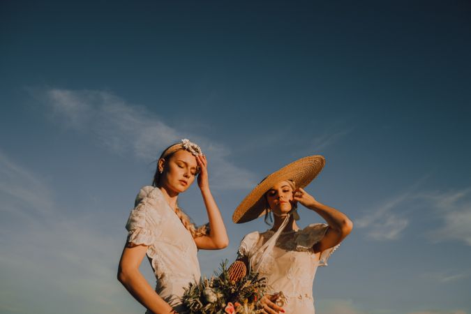 women in hats in bright sunny day