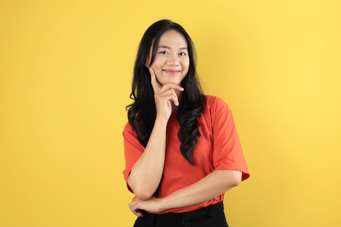 Woman In Orange Shirt  Looking at Camera