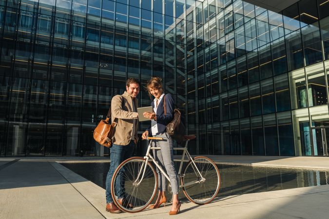Businesspeople talking on street after work