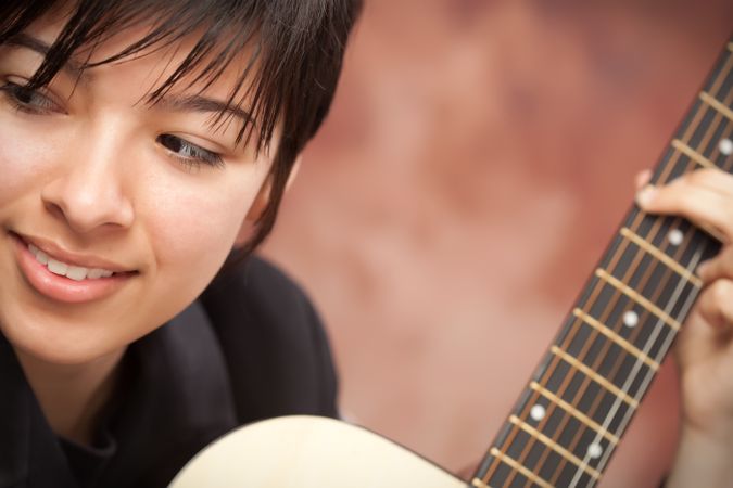 Happy Woman Plays Guitar