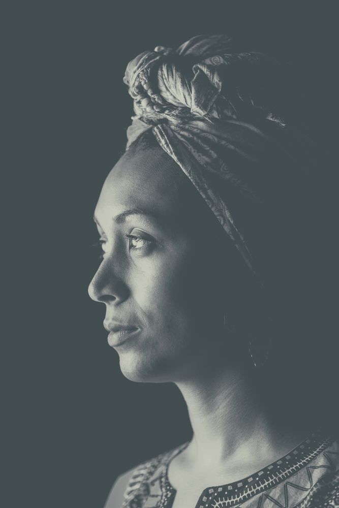 Black woman thoughtfully looking away