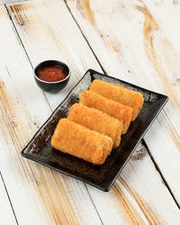 Pile of risol mayo keju, thin crepes rolled with egg and chicken inside