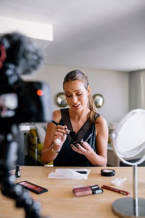 Fashion blogger recording video for her blog on makeup