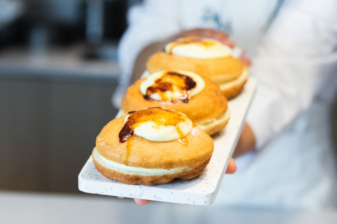 Crop cook with appetizing Berliners on board