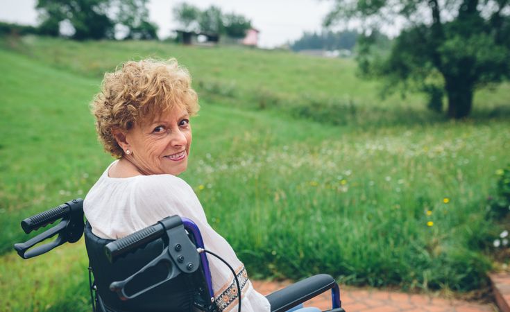 Woman in wheelchair in garden