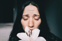 Portrait of woman with lily flower