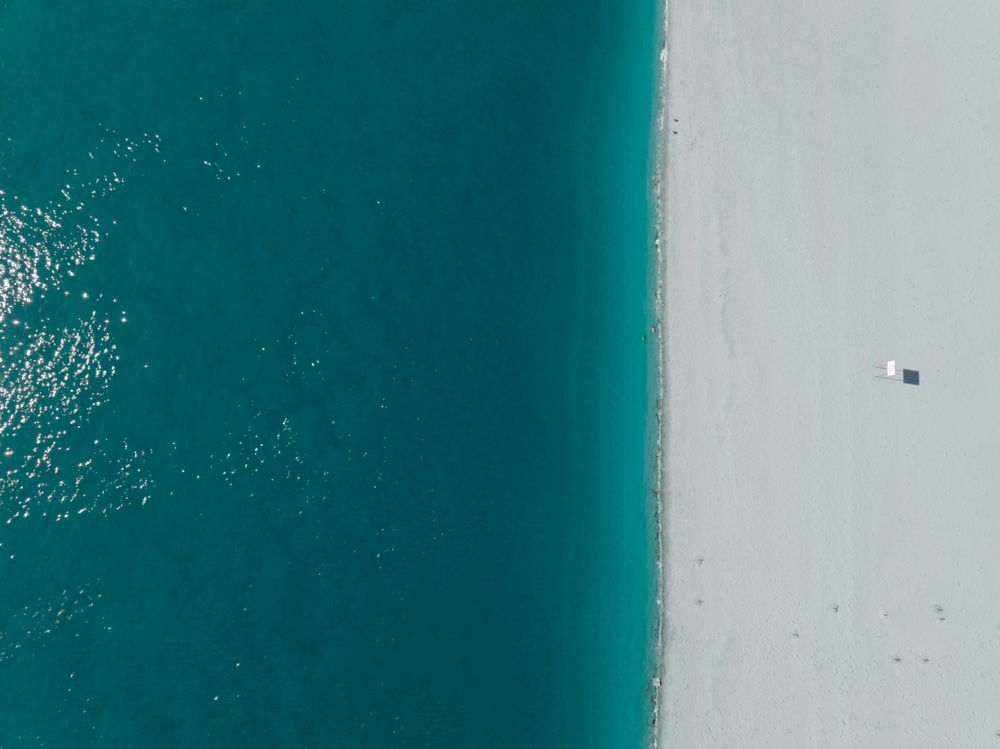 Aerial abstract photo of a calm blue water