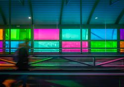 blur and moved person standing on travelator in airport