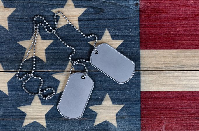 Close up of Military ID Tags on traditional USA nation colors