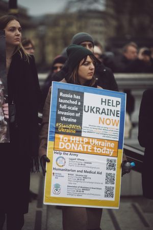 London, England, United Kingdom - March 5 2022: Woman with “help Ukraine now sign"
