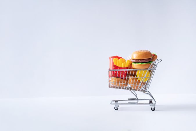 Shopping cart full with fast food items