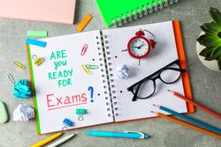 Composition with school supplies on grey background, top view