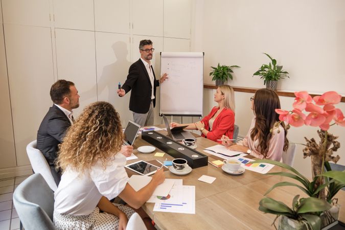 Group of colleagues working on project in office