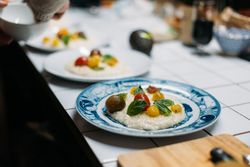 Plated risotto with tomatoes and basil