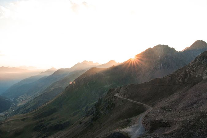Mysterious mountain high in row in sunlight