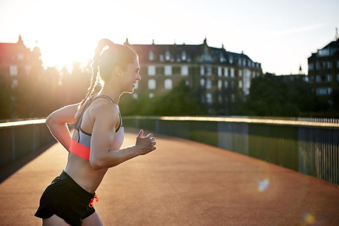 Fit woman exercising outside in the morning