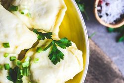 Top view close up of Ukrainian vareniki with parsley garnish