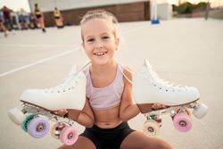 Portrait of girl demonstrating quads in city