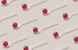 Pattern of red Christmas bauble on a spoon