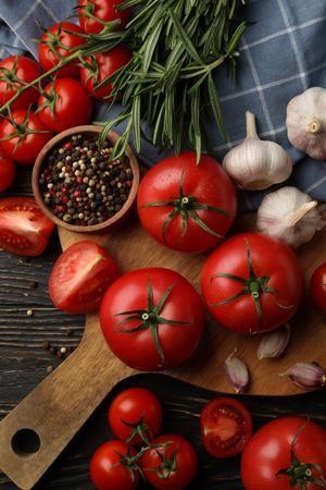 Composition with tomatoes on wooden background. Ripe vegetable