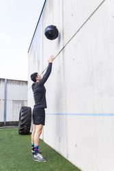 Man training with ball near wall