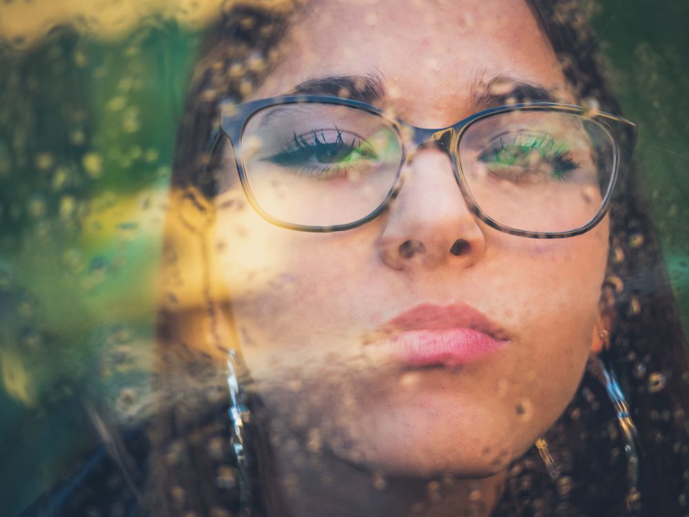 Woman in eyeglasses and earrings