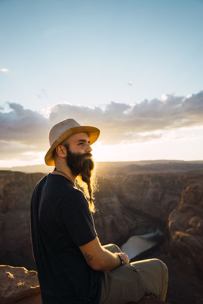 Bearded traveler looking at canyon