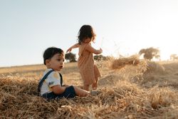 Children playing in the hay
