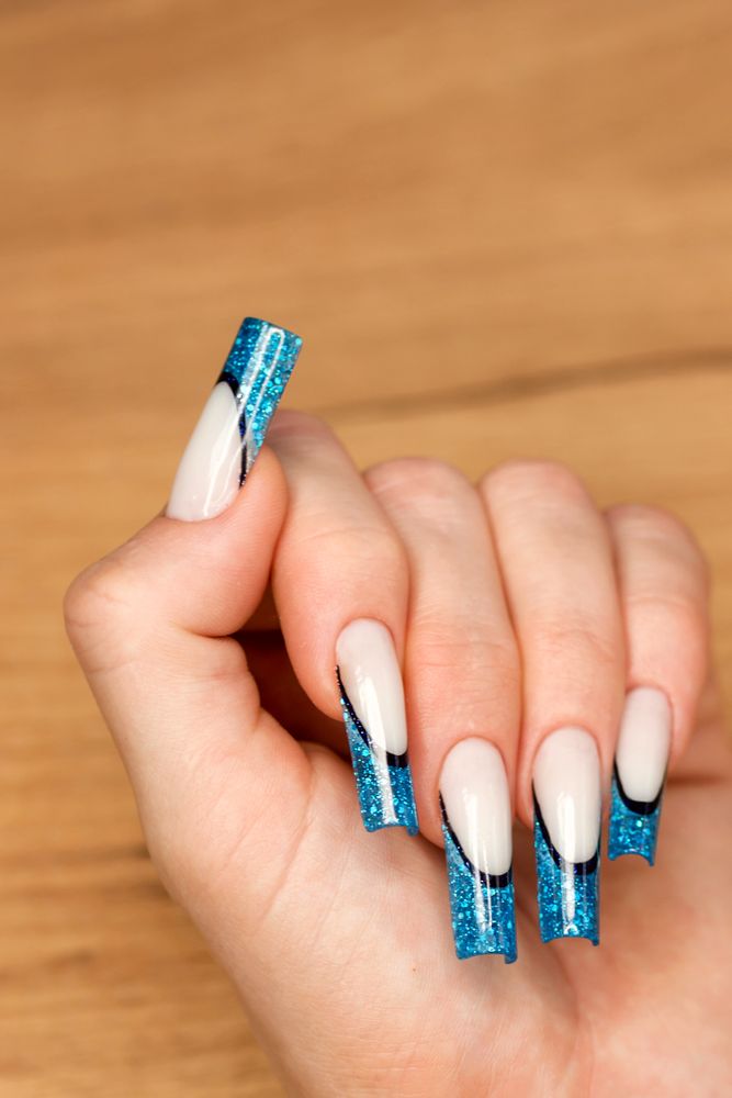 Chic Nail Art with Blue Glitter Detail