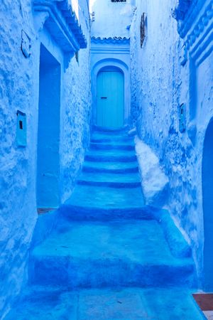Narrow way to door between old buildings