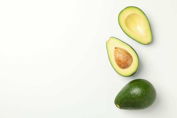 Ripe fresh avocado on blank background, top view