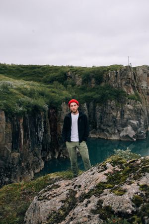 Portrait of man on cliff