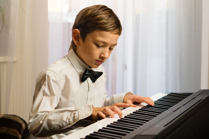 Young Boy's Piano Practice
