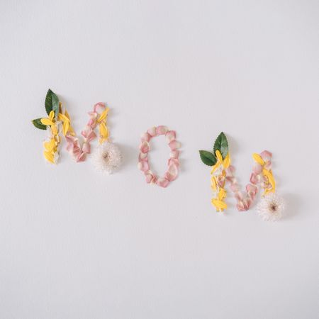 “MOM” text made with flower petals and leaves