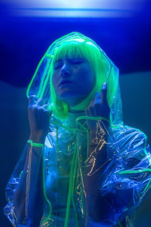 Asian woman posing in fluorescent light