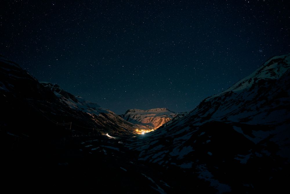 Lights of small settlements in snowy mountains