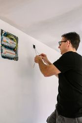 Electrician working on the electrical installation of a house