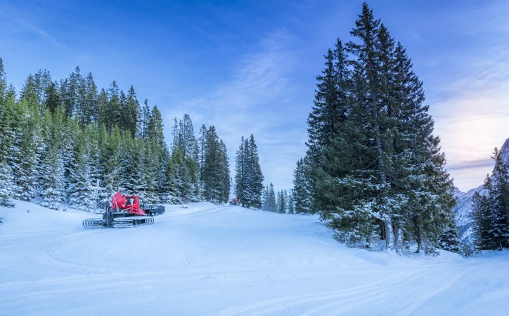 Snowy roads through alpine forest, in Austria