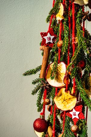 Close up of Christmas pine, baubles and dried fruit slices